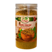 Burk med grön timjan palestinsk blandning, tydlig etikett och örtkrydda synlig.