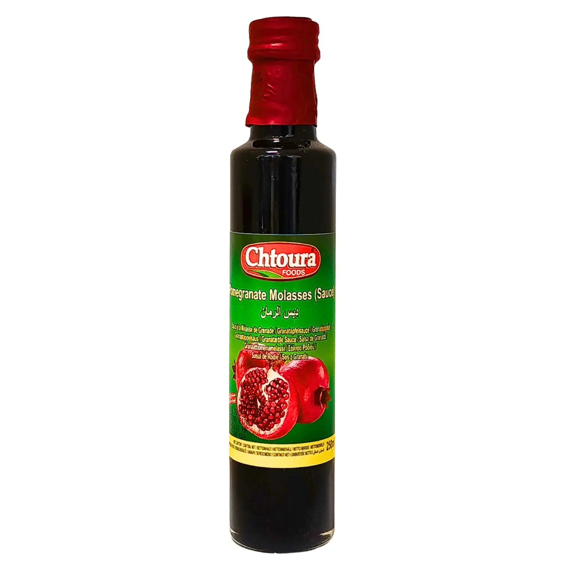 Flaska med granatäppelsirap, orientalisk sås med grön etikett och röda granatäpplen.