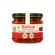 Harissa i glasburk med röd chilipepparmix och grön skruvlock.