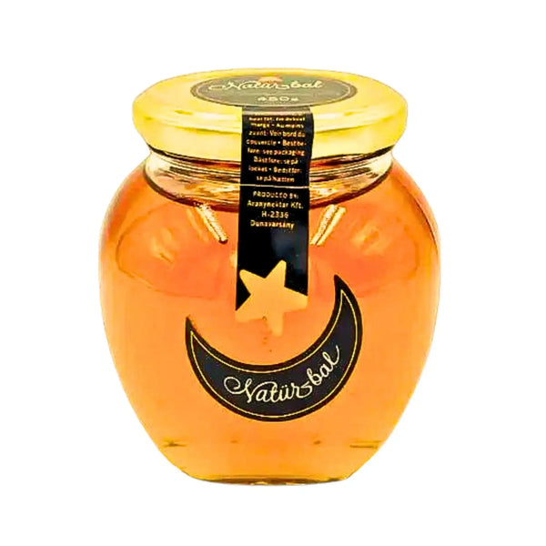 Glasburk med gyllene honungssirap, dekorativ etikett med stjärna och måne, 450g.