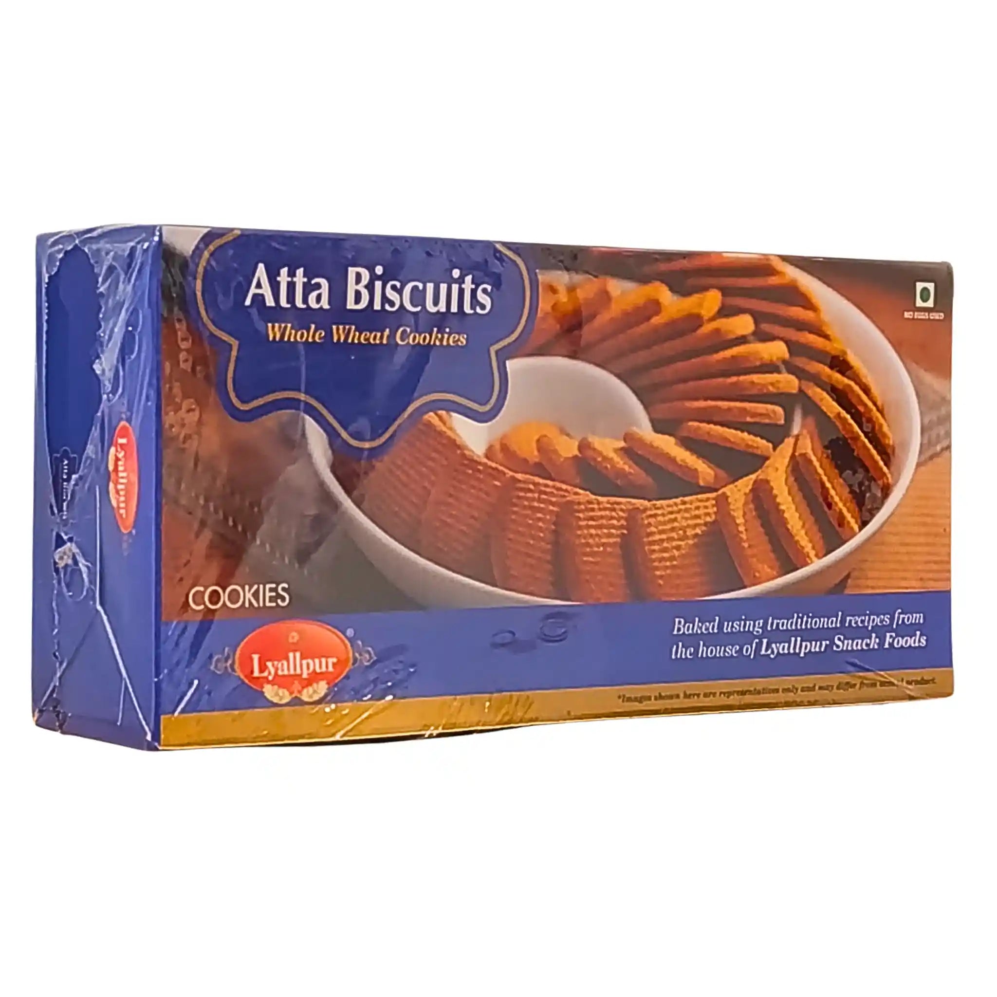 Förpackning med Atta Biscuits fullkornskakor, visad på ett bord, orientaliskt bakverk.
