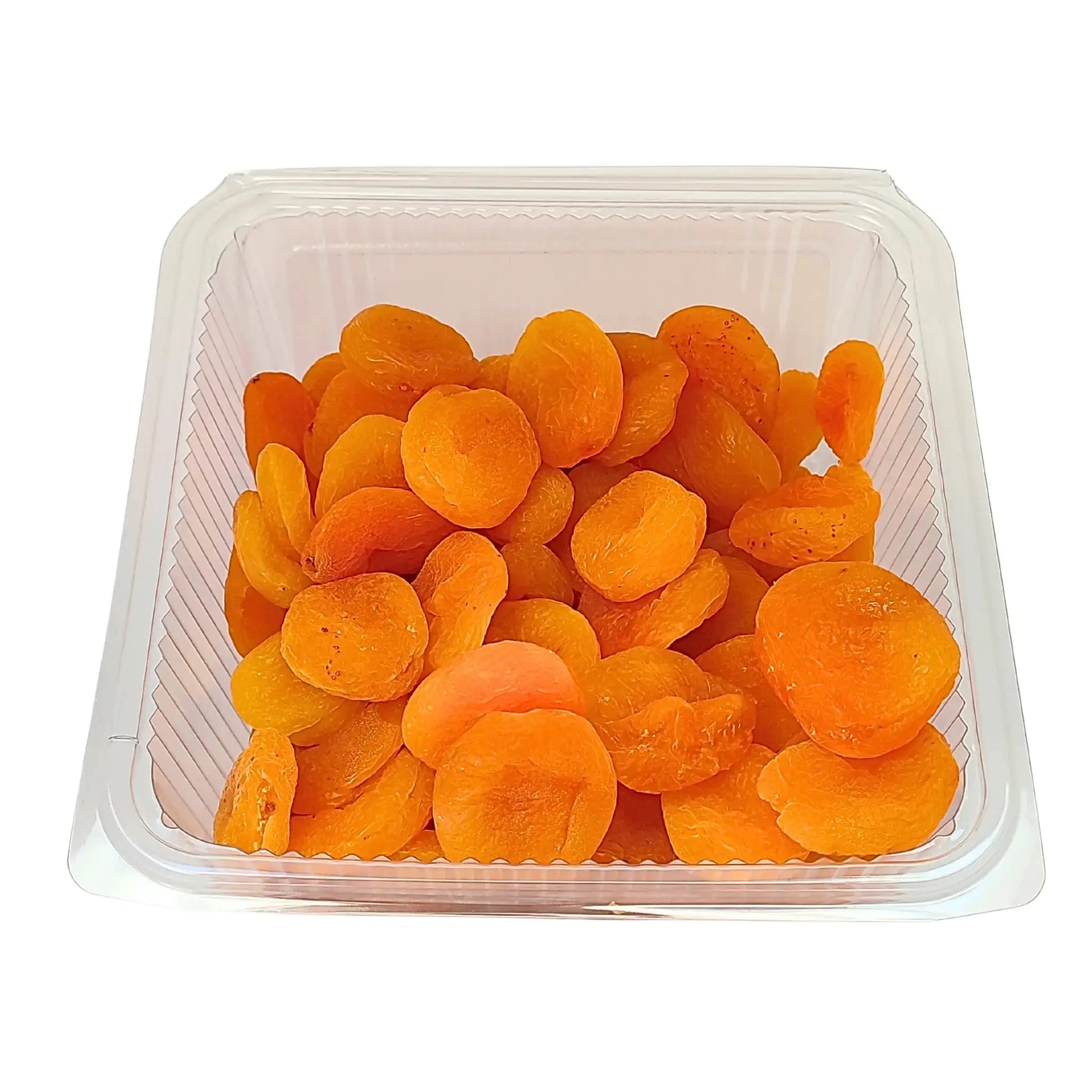 Torkade aprikoser i genomskinlig plastförpackning, orientaliska kolonialvaror.